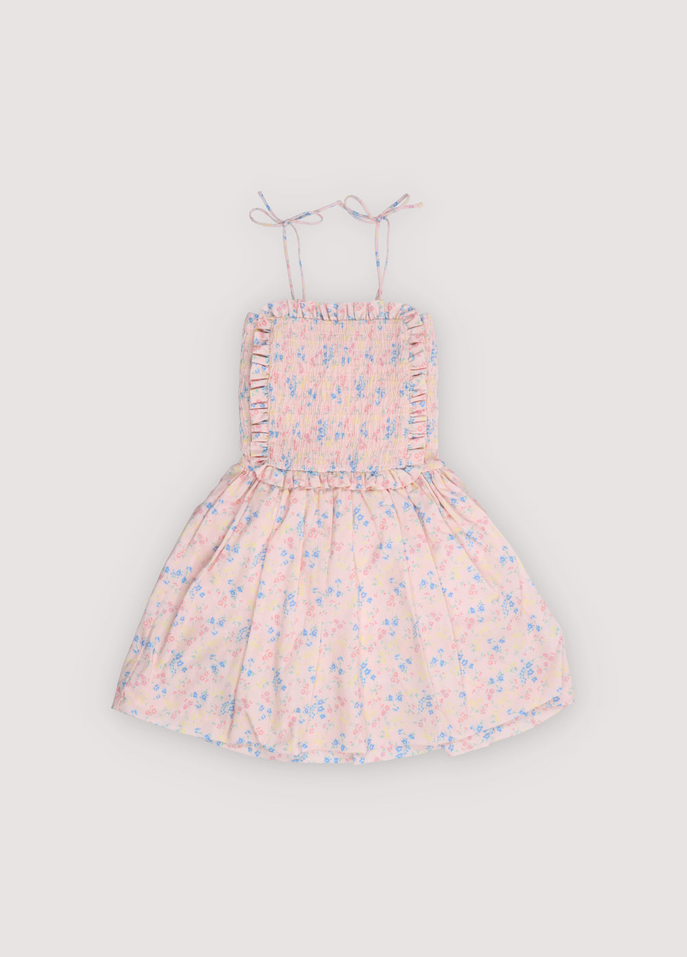 Robe en coton biologique avec un joli imprimé floral, dotée d'un corsage smocké avec une bordure à volants délicats pour une coupe confortable et flatteuse