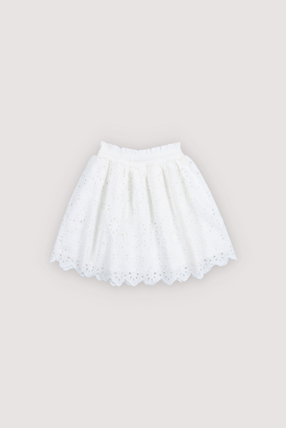 Skirt in beautiful embroidered fabric featuring an elastic waistband and soft cotton lining for comfort and ease of wear.