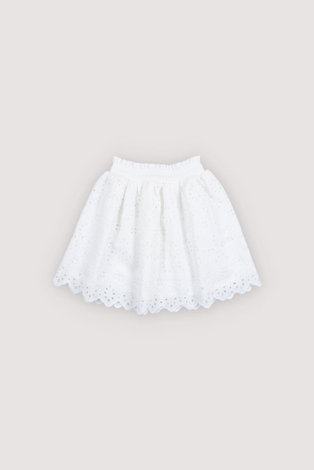 Skirt in beautiful embroidered fabric featuring an elastic waistband and soft cotton lining for comfort and ease of wear.
