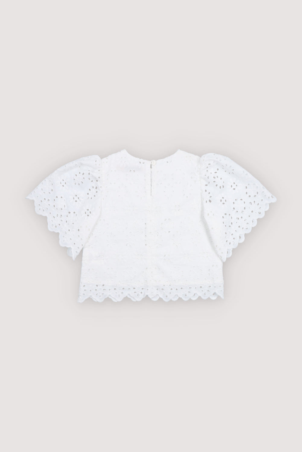 Blouse in beautiful embroidered cotton fabric featuring a gathered neckline and short raglan sleeves for a soft, feminine silhouette