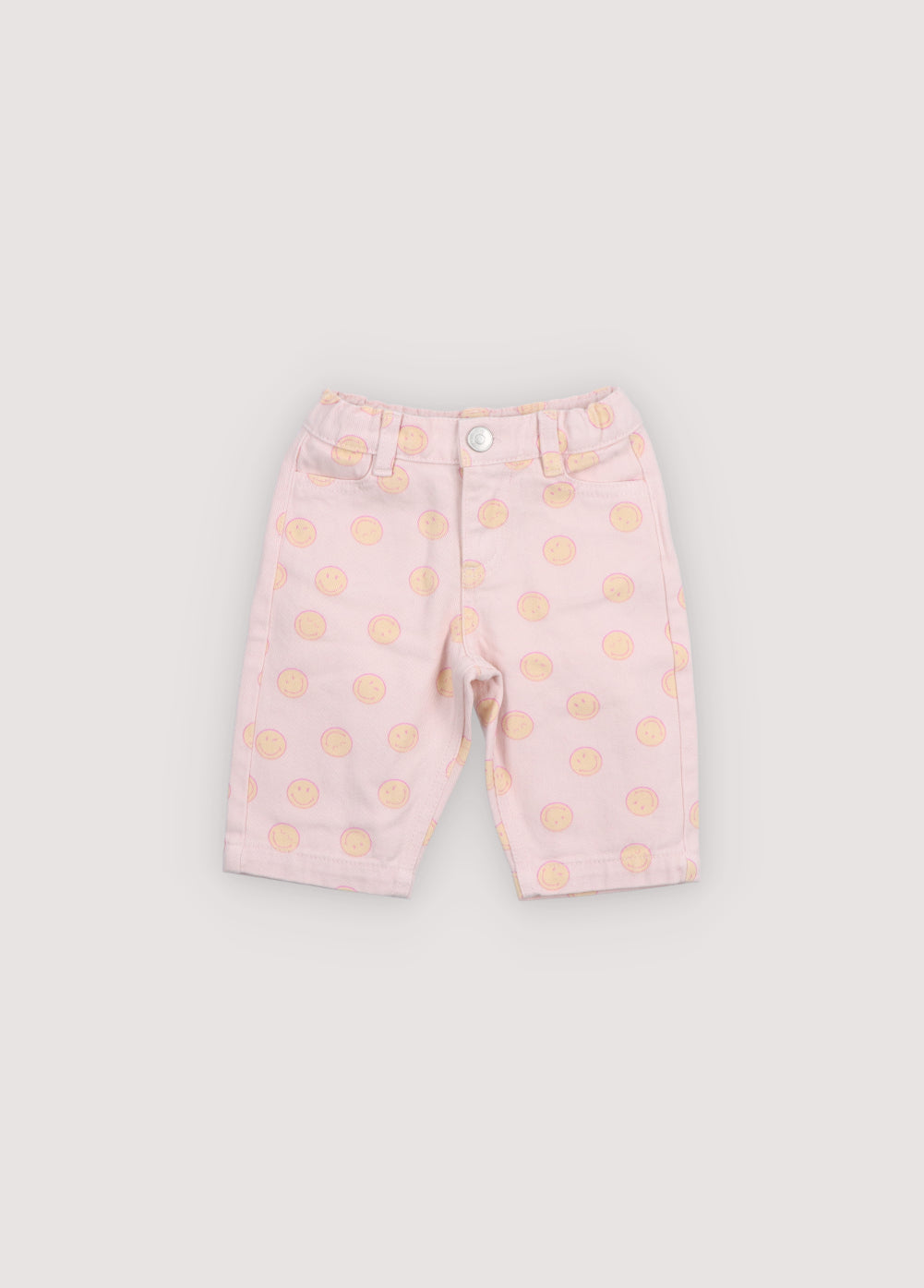 Denim pants featuring a fun SmileyWorld® print and a comfortable elastic waistband for an easy, playful fit.