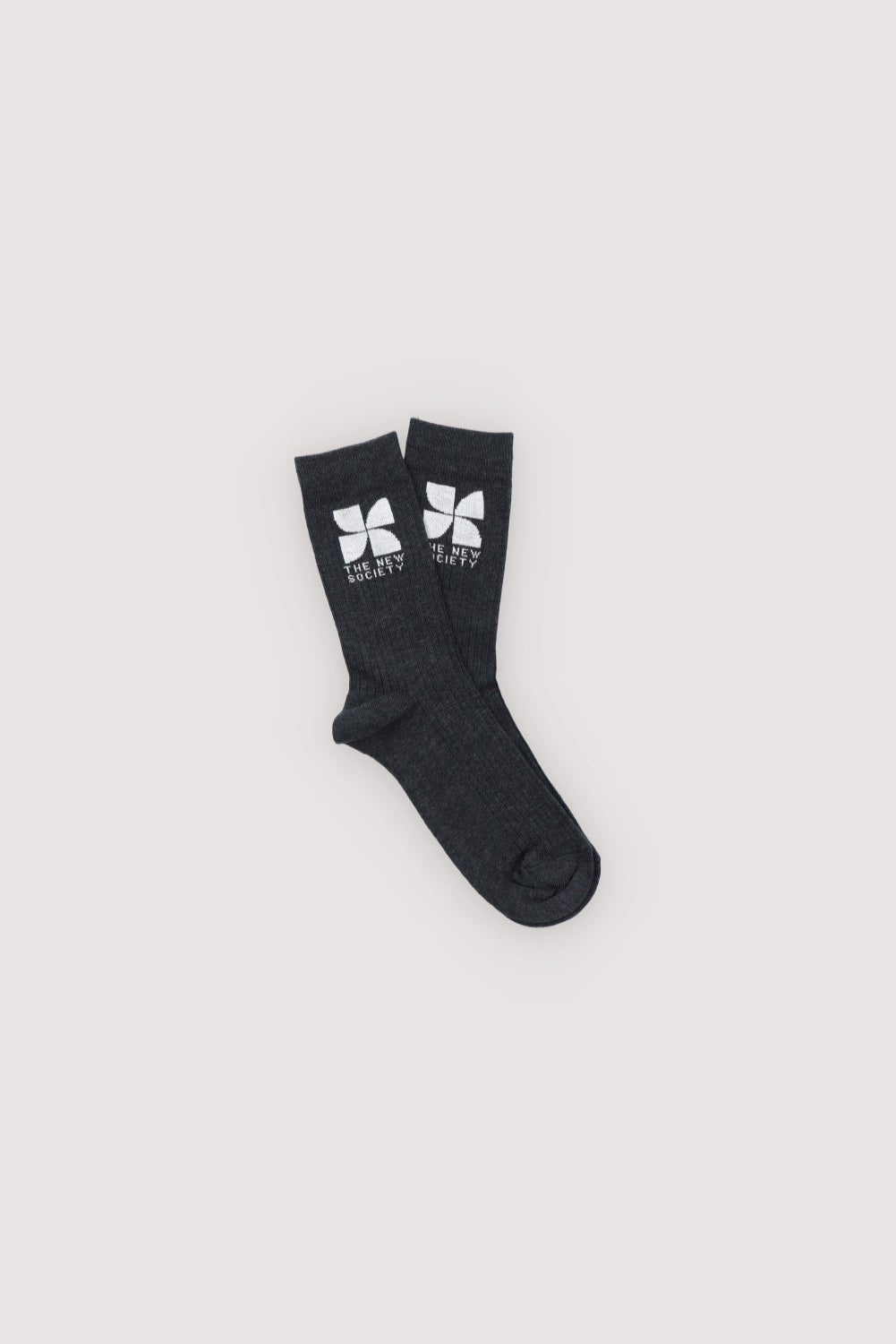 Black socks with a logo on a light gray background