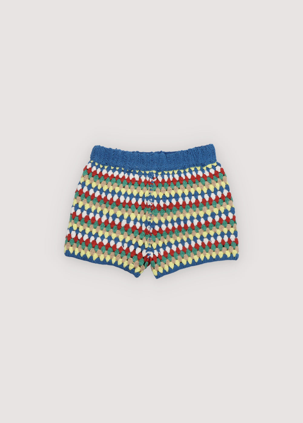 Crochet shorts with colorful stripes and ribbed elastic waistband. It comes with a jumper and a bucket hat to create a total look. Spring Summer Collection. The New Society.