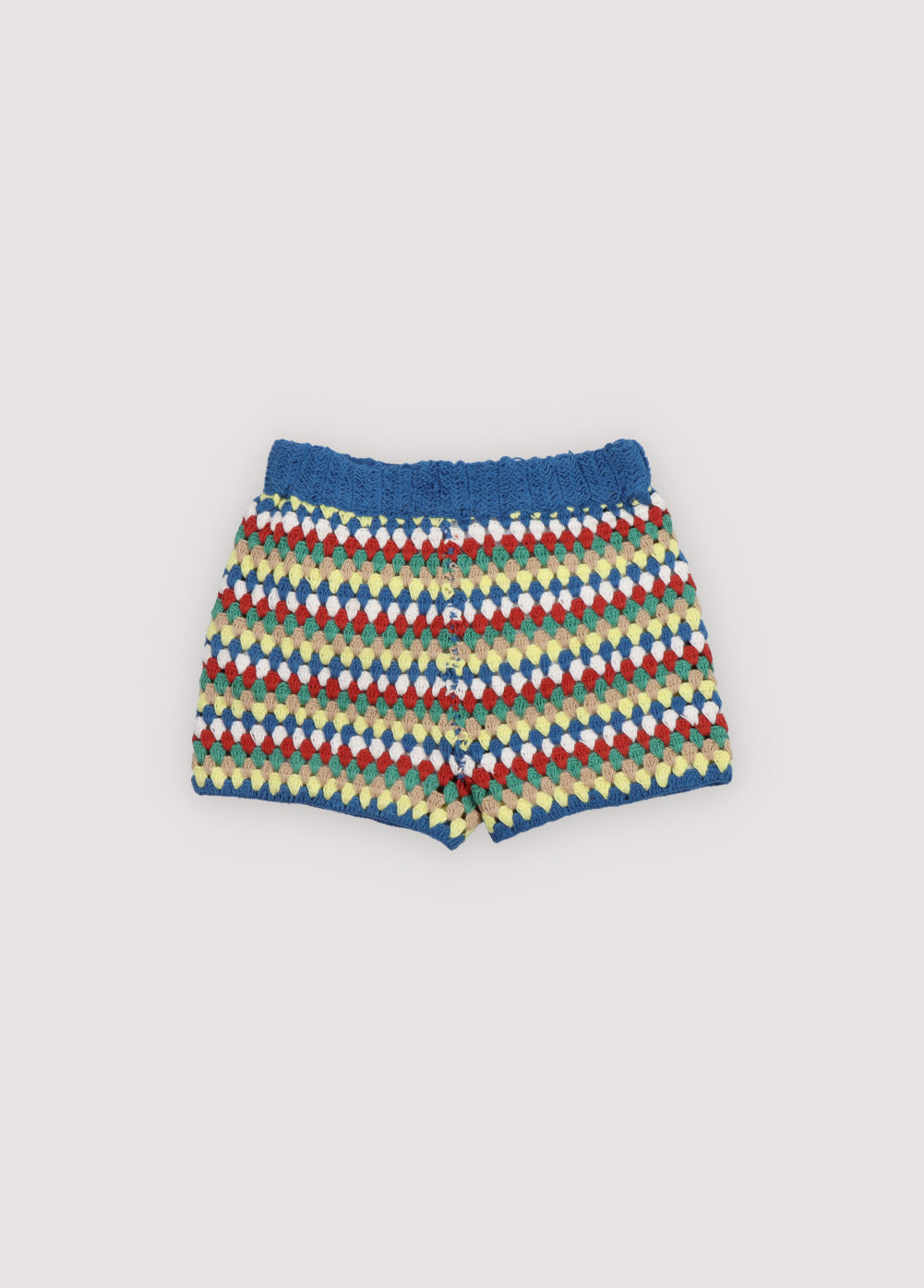 Crochet shorts with colorful stripes and ribbed elastic waistband. It comes with a jumper and a bucket hat to create a total look. Spring Summer Collection. The New Society.