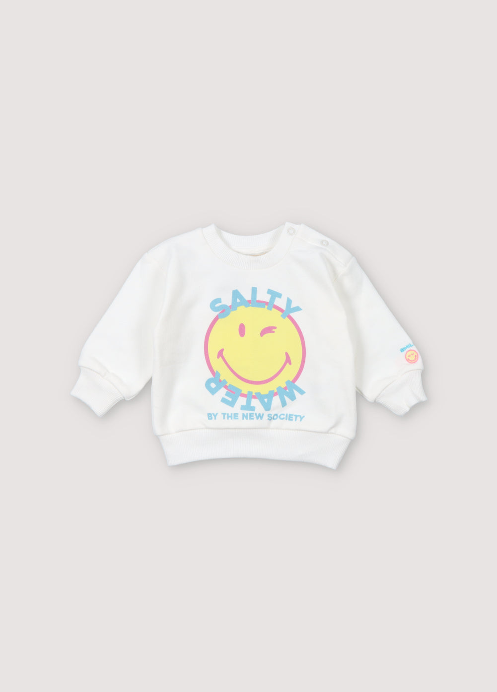 SMILEYWORLD sweatshirt with a colorful print on the front and a patch in the same colors on the sleeve. It has snaps in tone on shoulder Spring Summer Collection. The New Scoiety.