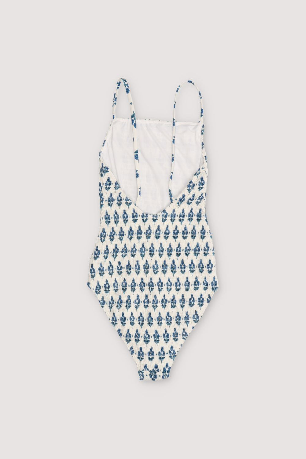 Smocked swimsuit with stamp print and open back. Sprin Summer Collection. The New Society.