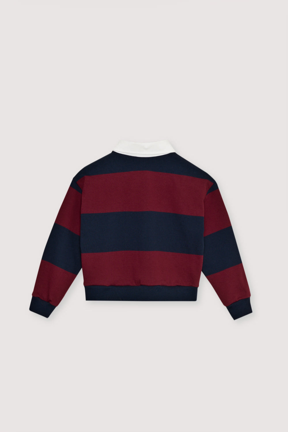 Bicolor striped crop polo with a contrasting collar in twill fabric. It features a contrasting print on the chest.