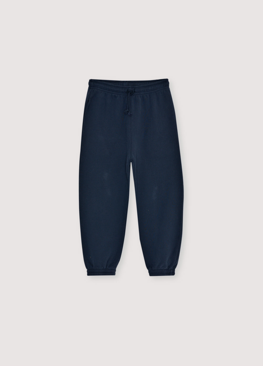 Fleece joggers brushed inside and outside with an adjustable elastic waistband and drawstring, and elastic cuffs. Brushed on the inside and outside. Perfect for creating a comfortable total look with the matching sweatshirt. It features a brand print detail on the front side.