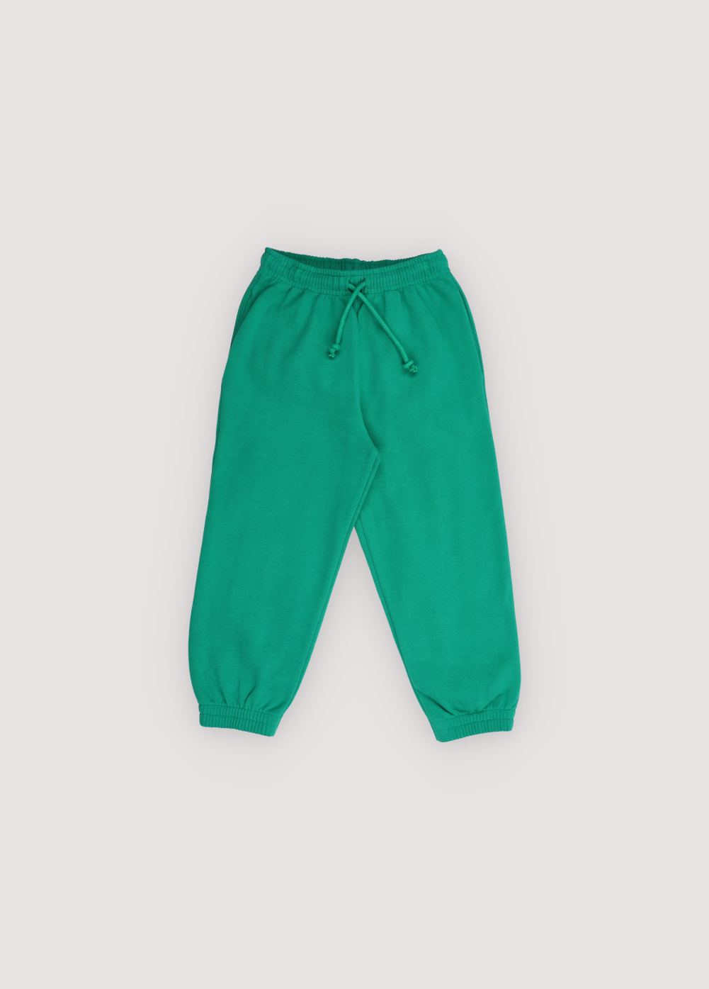 Fleece joggers brushed inside and outside with an adjustable elastic waistband and drawstring, and elastic cuffs. Brushed on the inside and outside. Perfect for creating a comfortable total look with the matching sweatshirt. It features a brand print detail on the front side.