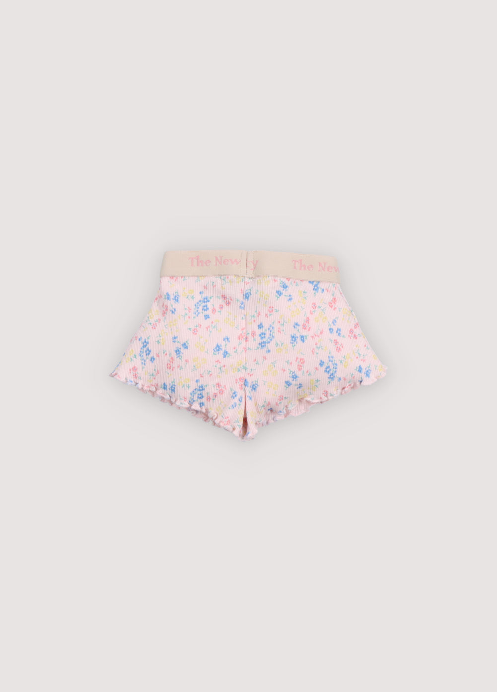 Pantalón corto para bebé de la nueva colección, confeccionado en suave tejido de canalé con el mismo bonito estampado floral que la camiseta a juego.