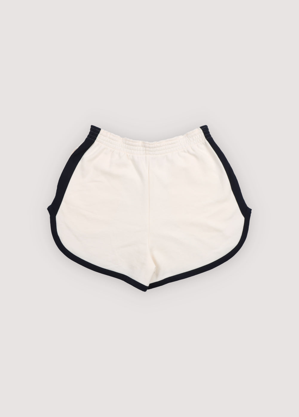 Cotton fleece shorts featuring contrast stripes on the sides and hem, branded embroidery on the hem, side pockets, and an adjustable waistband with drawstring. Perfect for pairing with any other piece from the collection for a coordinated look.