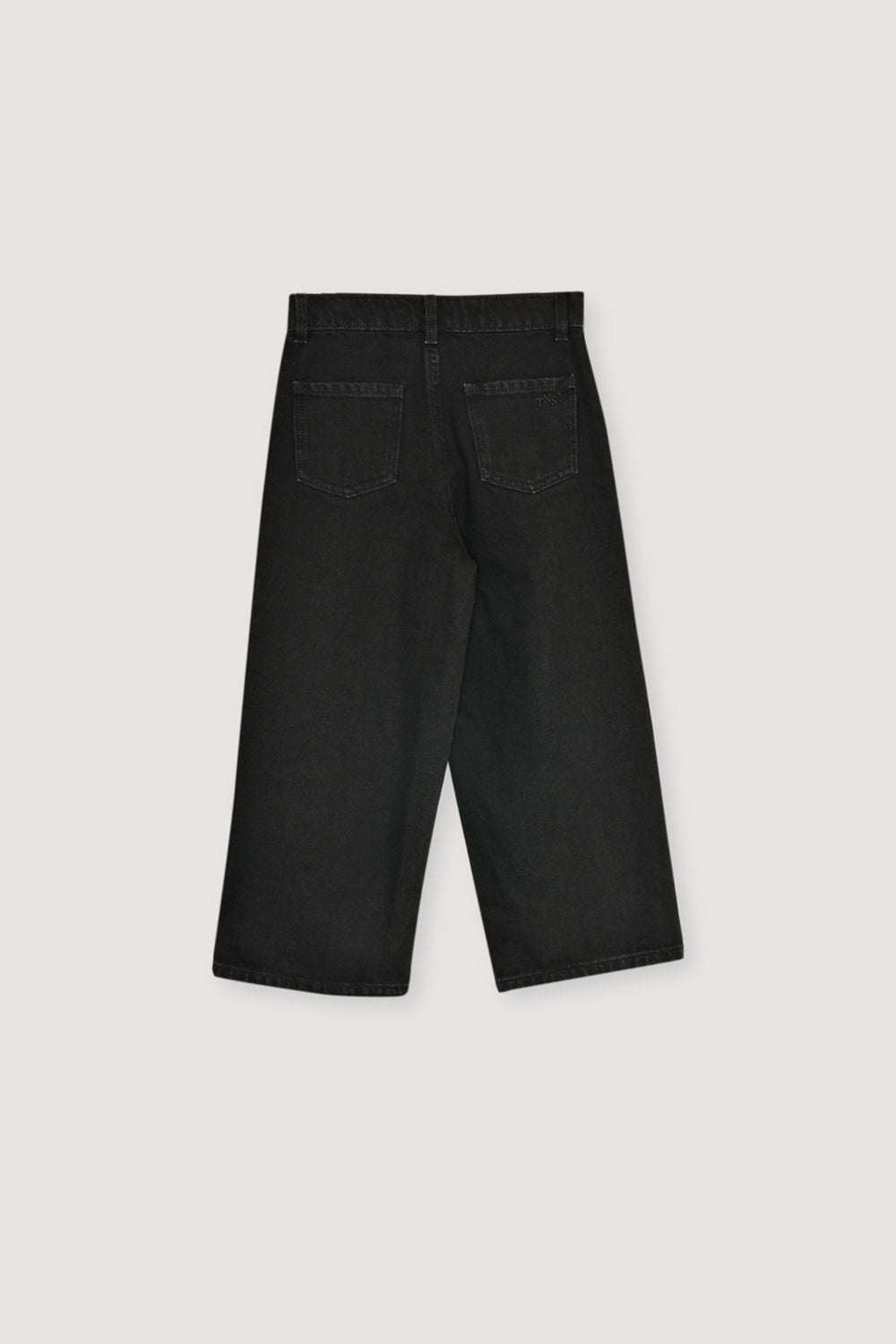 Kids’ wide-leg denim pants in a classic black wash, offering a comfortable and stylish look.