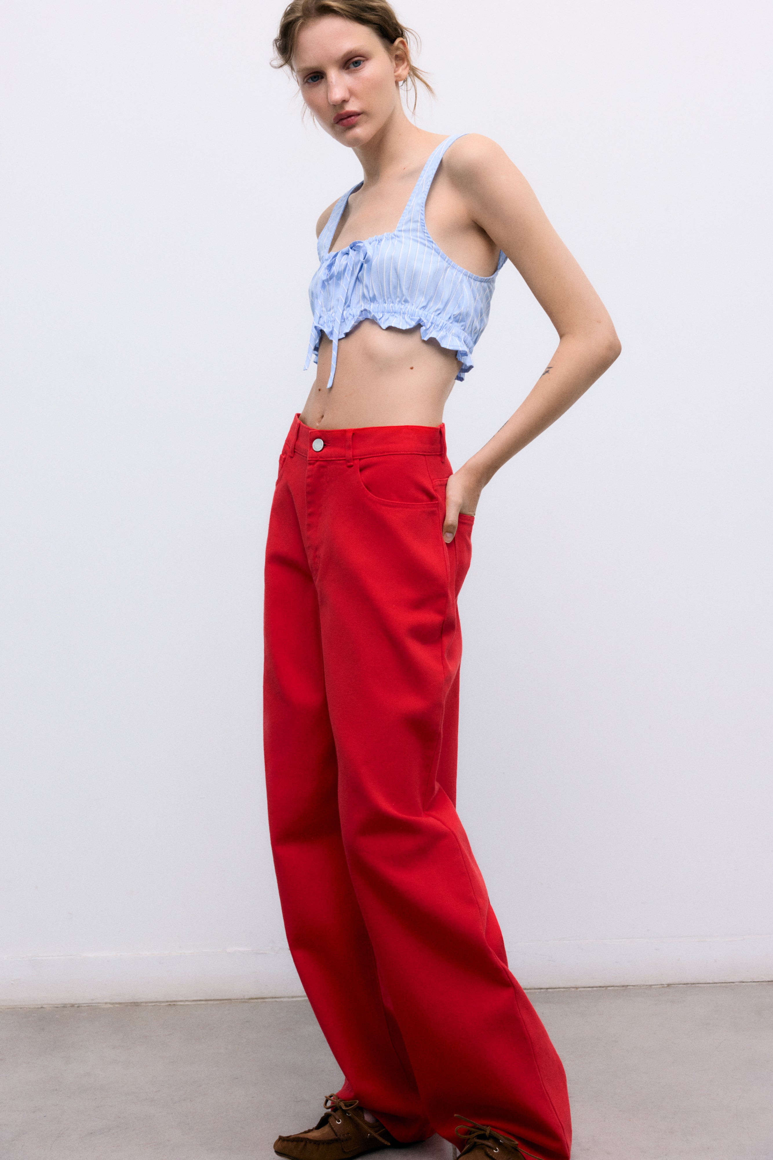 Our classic wide-leg pants crafted from soft 100% cotton denim, now available in a beautiful red shade that adds character and style to any outfit.