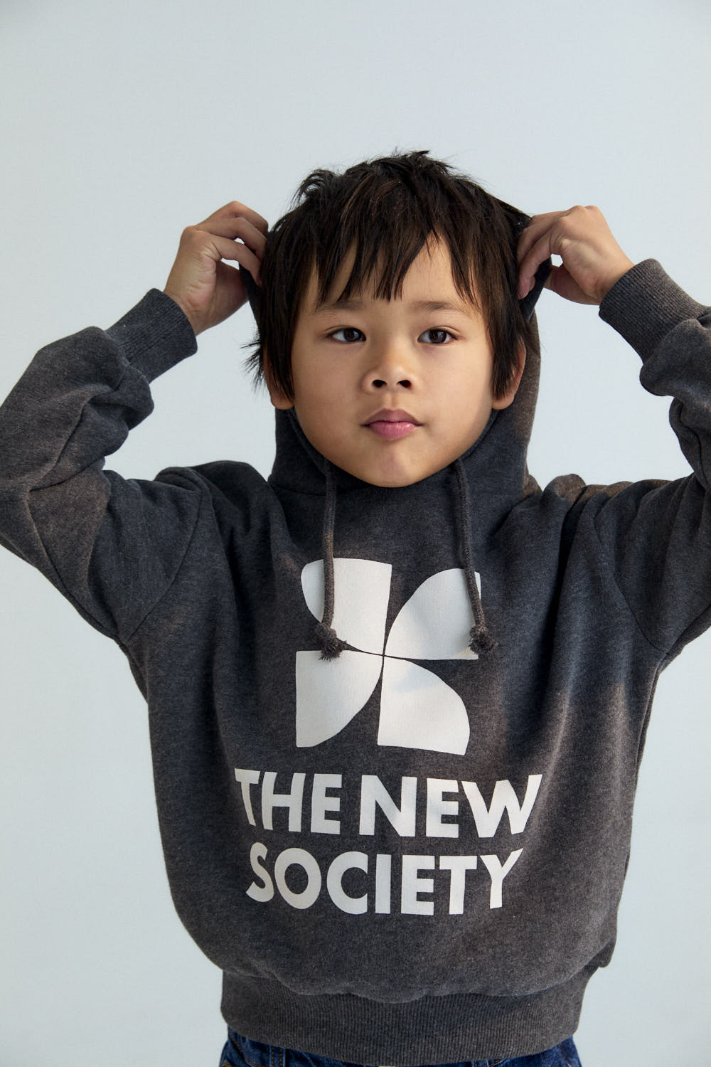 Wrap yourself in comfort and style with this Galactic Grey hoodie, featuring a bold contrasting brand logo on the front.