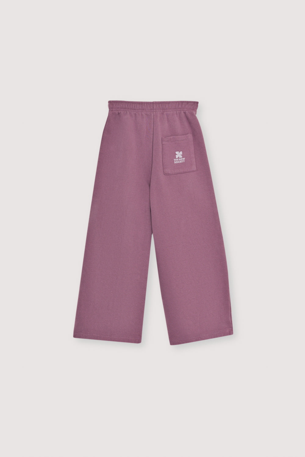 Fleece joggers brushed inside and outside with a wide-leg fit and an elastic, adjustable waistband with a drawstring. Brushed on the inside and outside. It has an embroidery detail on lurex cord.