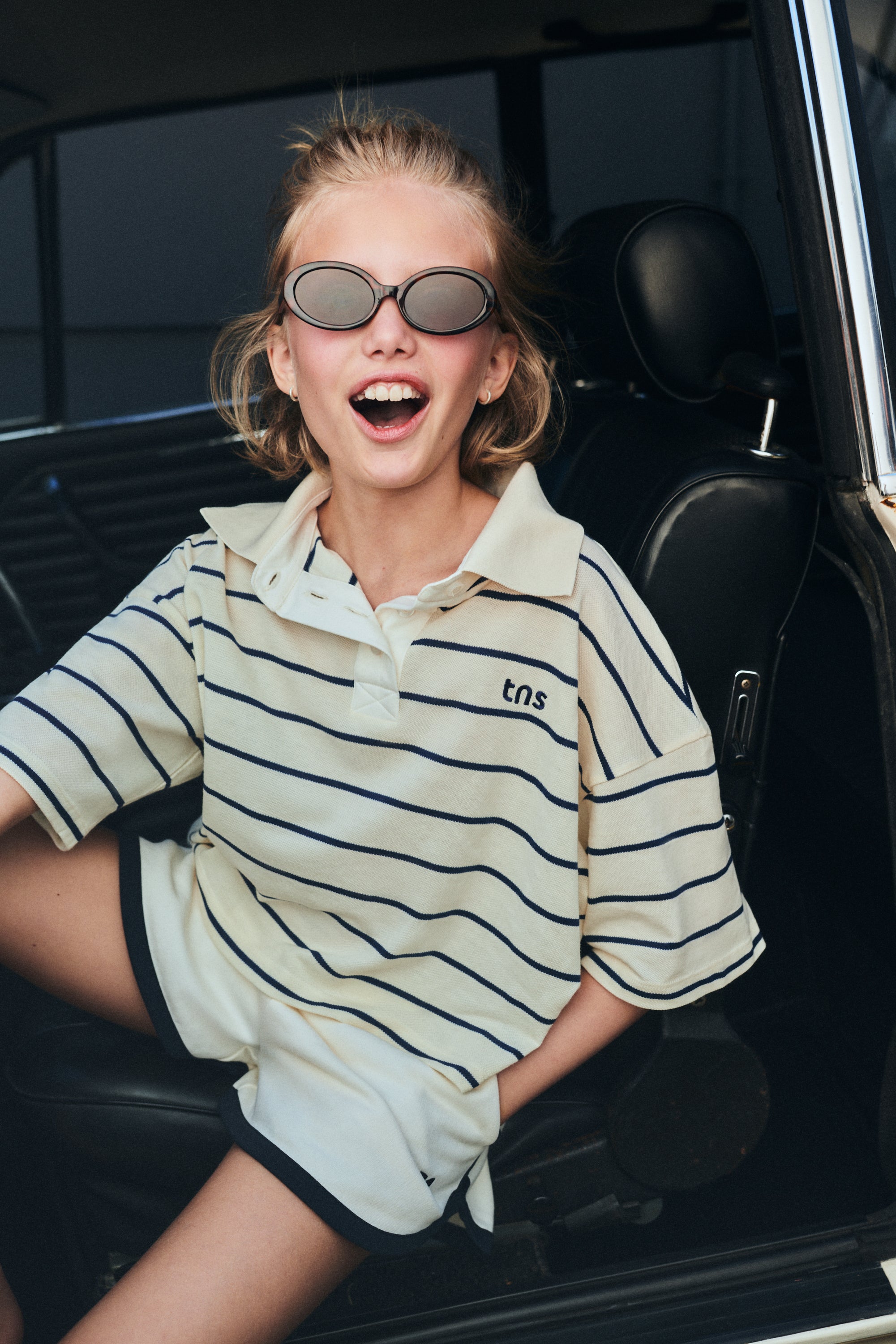 Cotton fleece shorts featuring contrast stripes on the sides and hem, branded embroidery on the hem, side pockets, and an adjustable waistband with drawstring. Perfect for pairing with any other piece from the collection for a coordinated look.