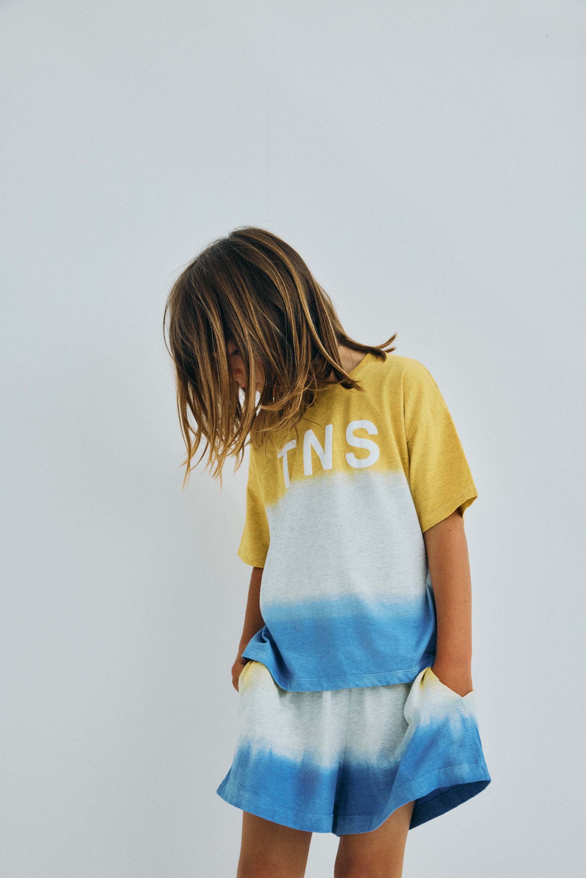 Melange cotton jersey T-shirt with a soft, comfortable finish and a two tone tie dye effect, featuring a TNS print on the front.