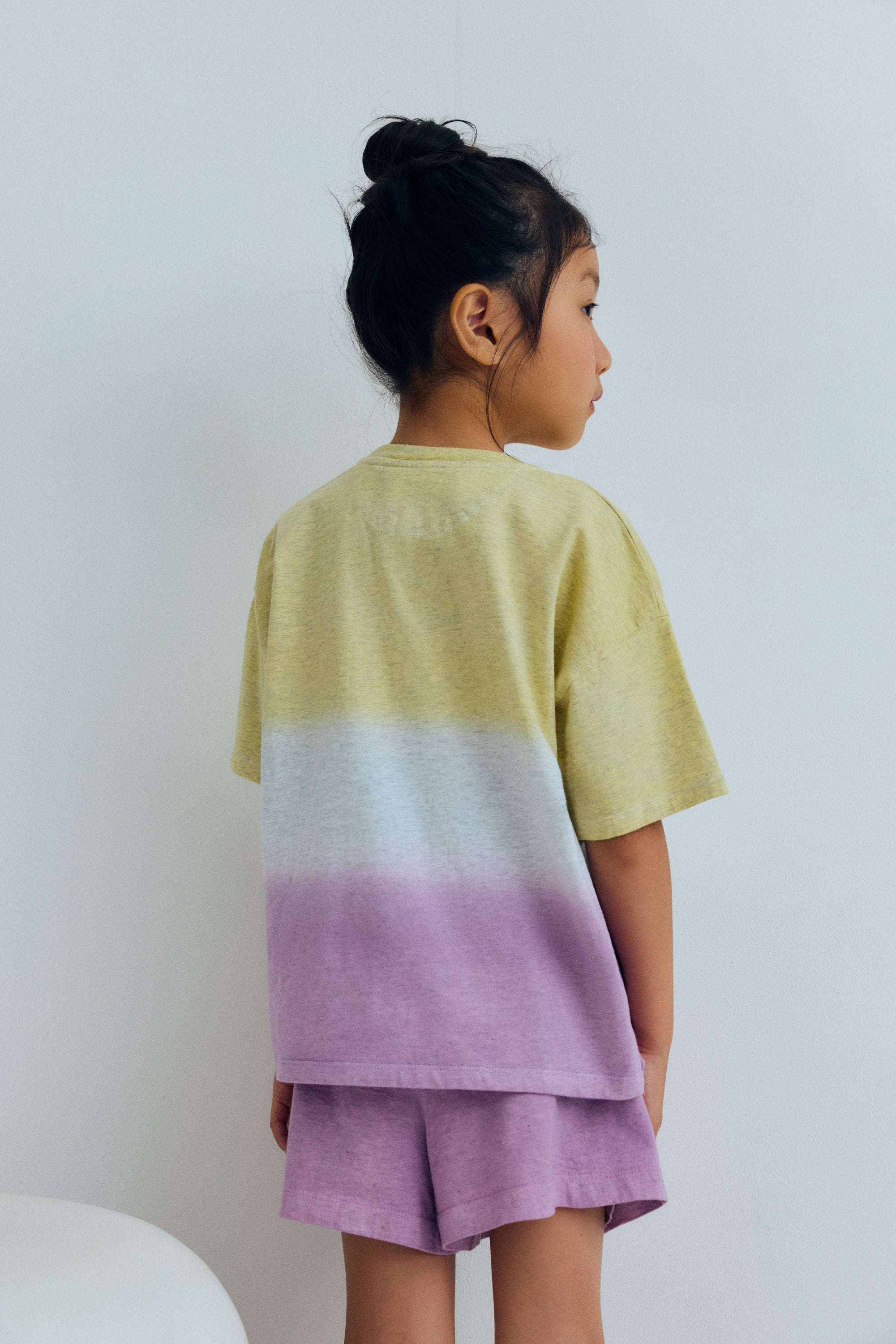 Kids T-shirt crafted from 100% melange cotton jersey with a soft finish and a two-tone tie-dye effect.