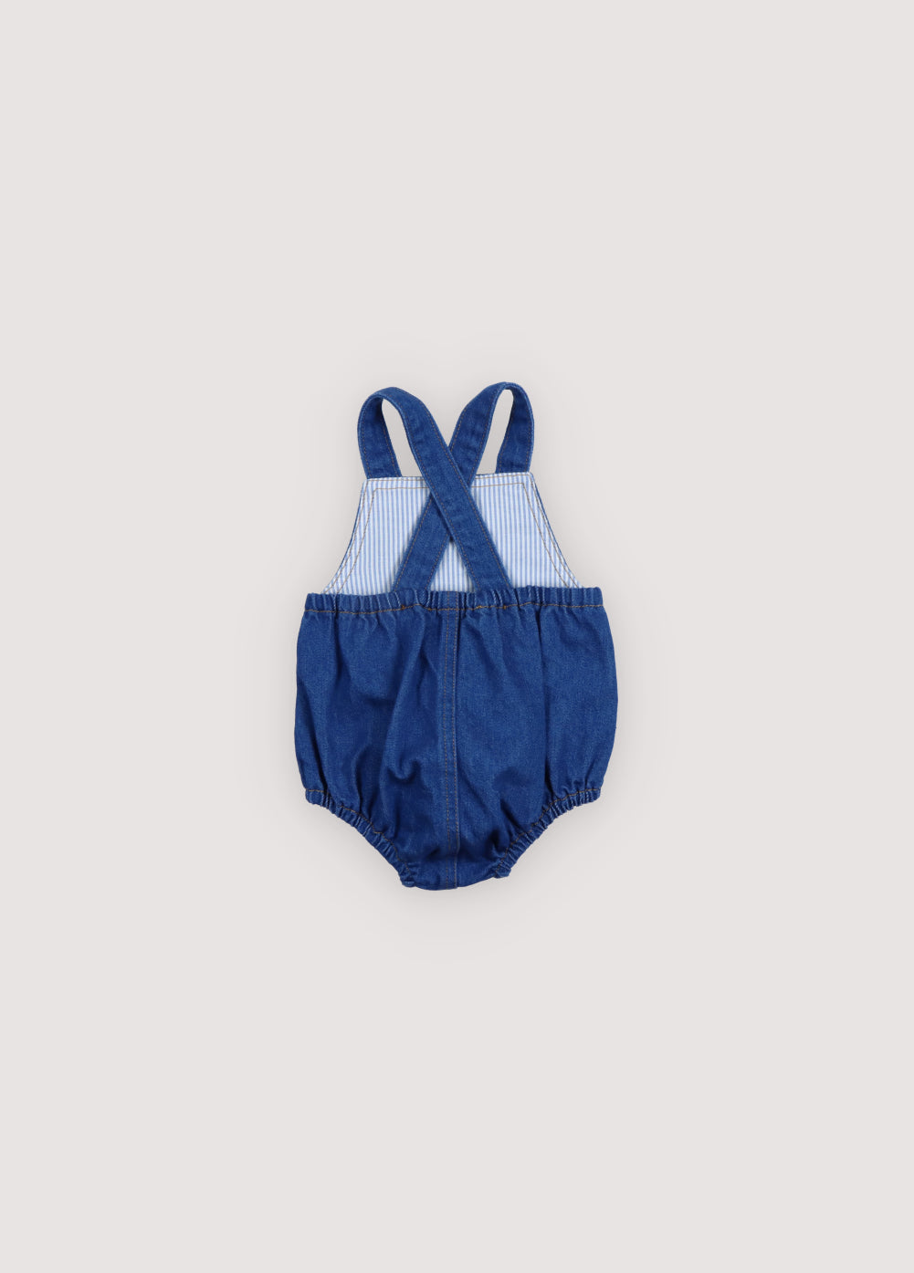 Pelele para bebé confeccionado en denim 100% algodón.