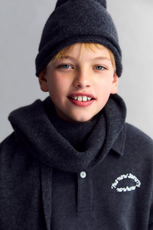 Fleece polo with a tone-on-tone brand print detail on the chest.