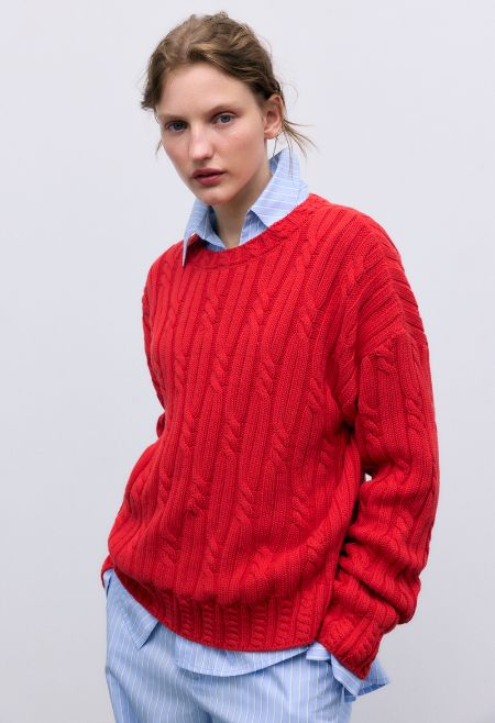 Cable knit sweater in soft cotton, featuring delicate cable details on the collar, cuffs, and hem