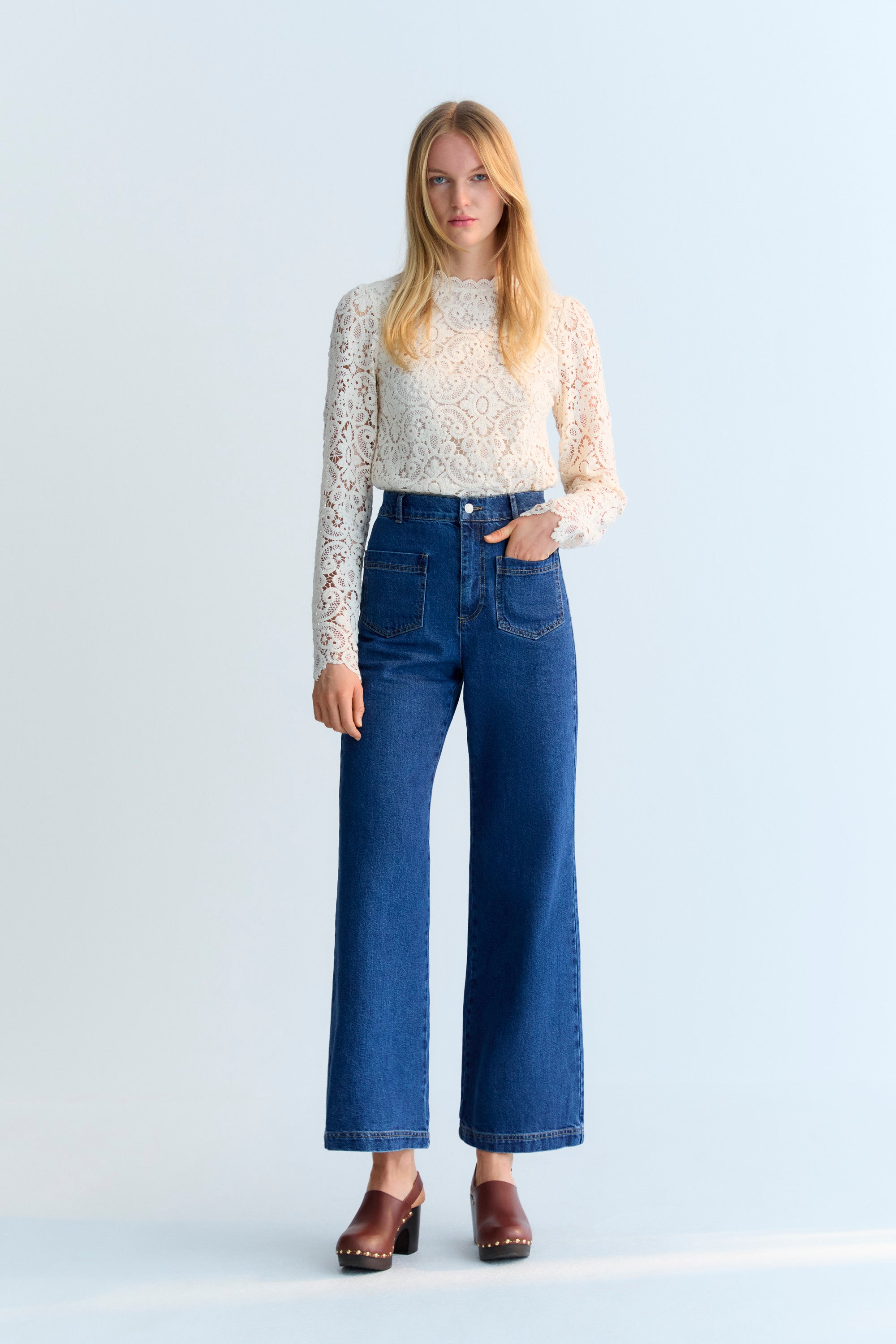 70s-inspired denim pants with front patch pockets and back dart detail with pocket.