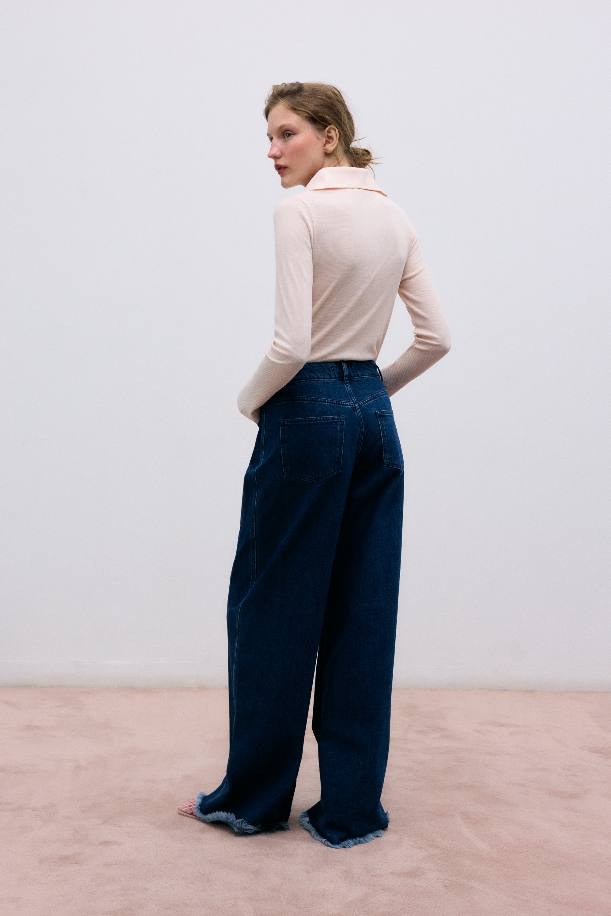 Fine rib body crafted from recycled cotton, designed for a sleek and comfortable fit