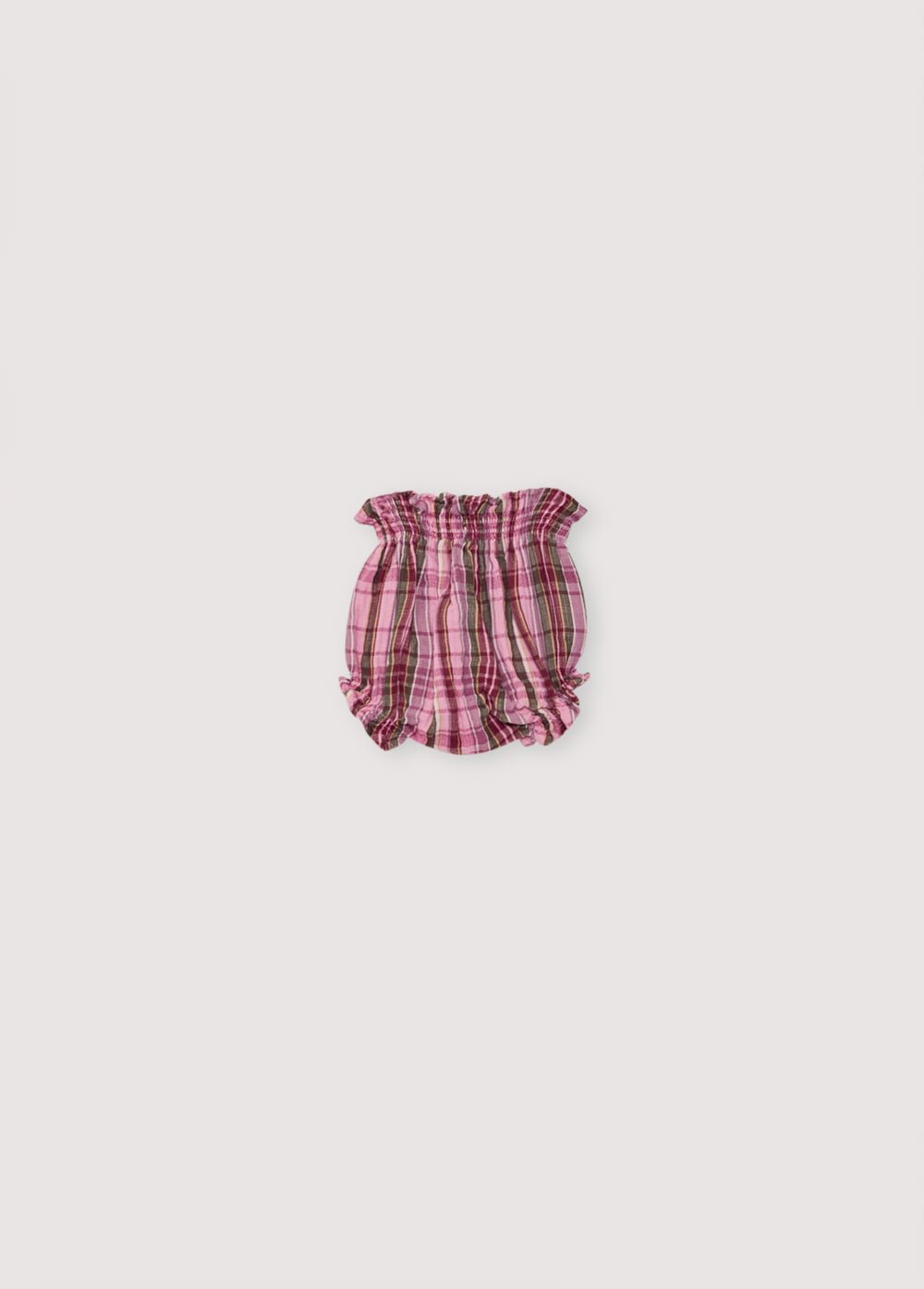 Bloomer bébé en double gaze à carreaux, avec élastique aux poignets et à la taille. Parfait pour créer un total look avec la blouse.