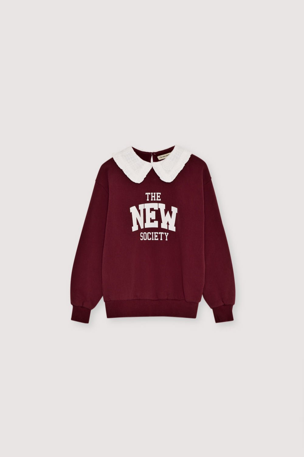 Brushed fleece sweatshirt with a brand print and collar with english embroidery. It features a teardrop opening on the back with a button closure. Brushed on the inside and outside.