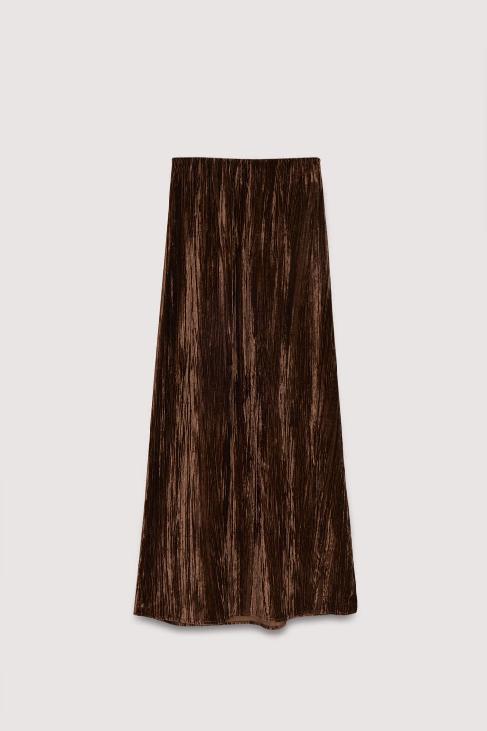 Cette jupe droite légèrement trapèze en velours de couleur Roast offre une texture douce et une silhouette épurée, finie avec une fermeture éclair latérale discrète pour un port facile. Collection Femme AW25. The New Society