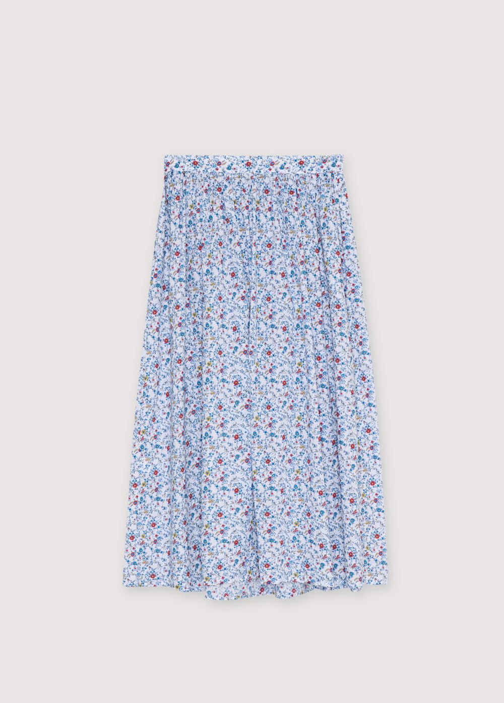 Apportez une touche de féminité intemporelle à votre garde-robe avec cette jupe bleue à fleurs, parfaite pour rehausser des looks décontractés ou raffinés.