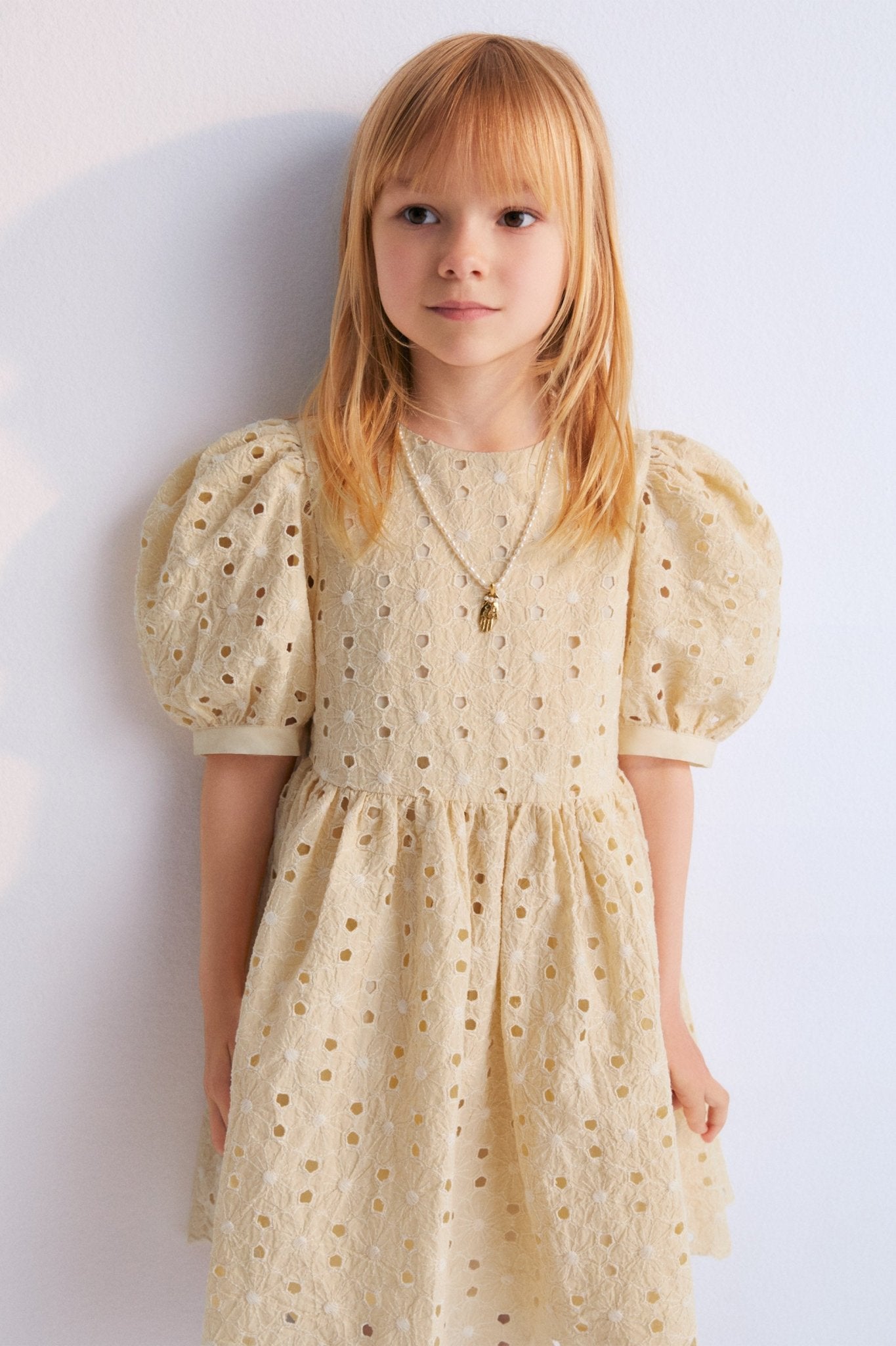 Creta Dress our bestseller now with embroidered blend cotton fabric in macadamia color. Dress with puffed sleeves and a flared skirt.