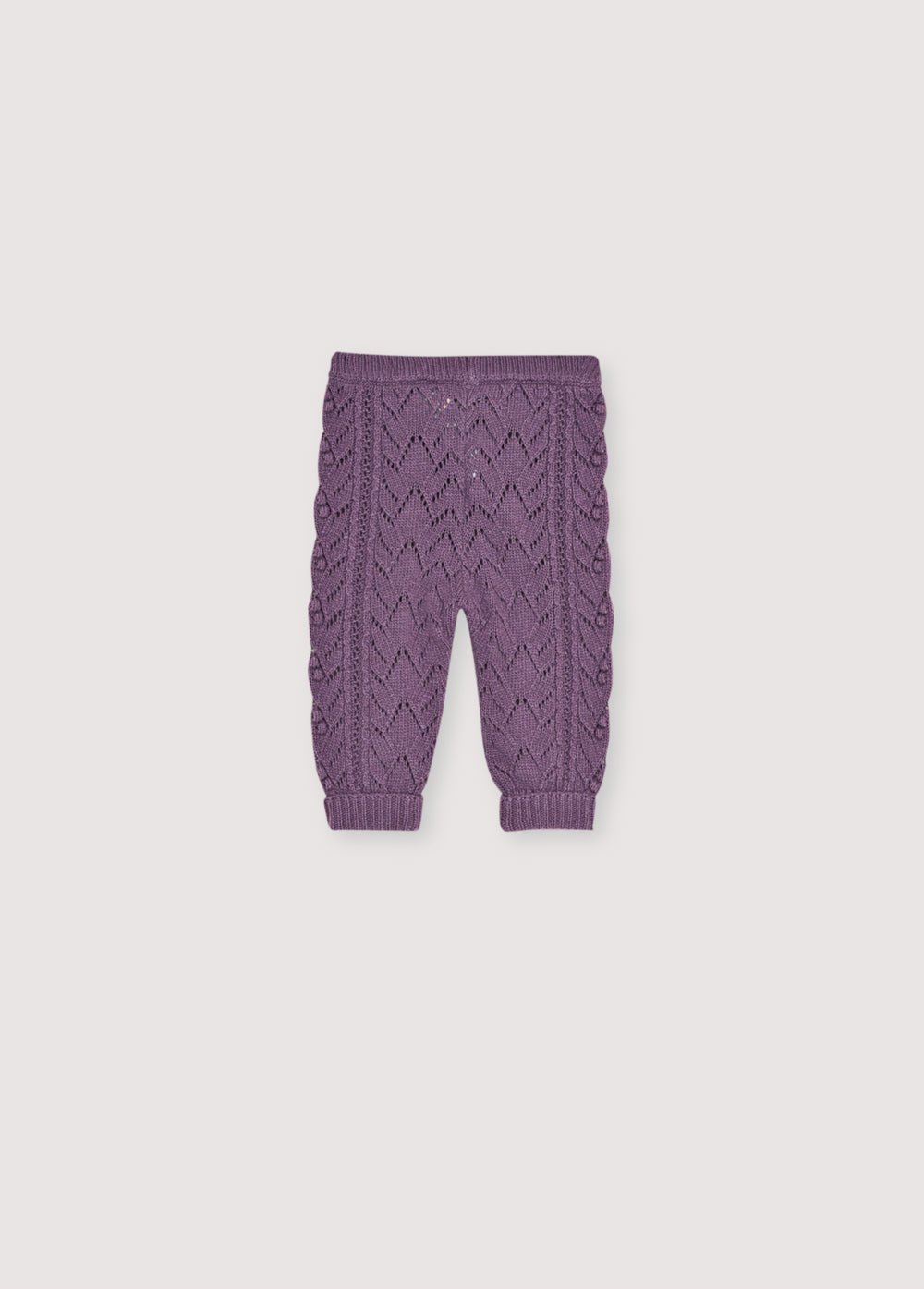 Leggings en cachemire et laine recyclés avec un magnifique design en tricot. Il est accompagné d'un cardigan assorti pour créer un look complet.