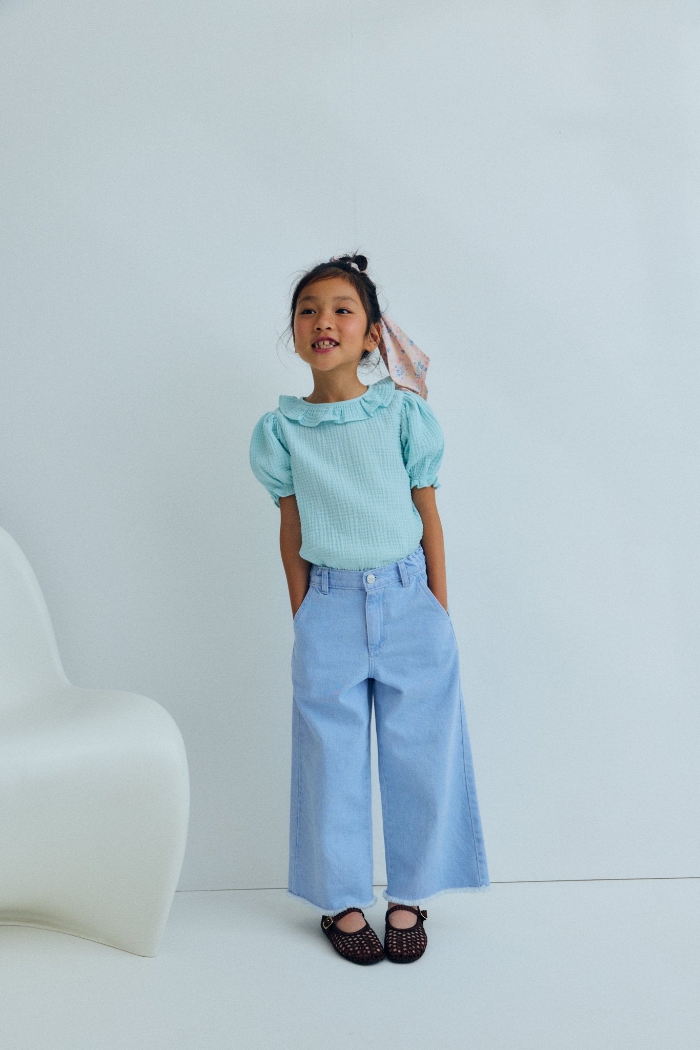 Wide leg denim pants in a soft washed finish, featuring straight legs and an adjustable waistband with interior elastic