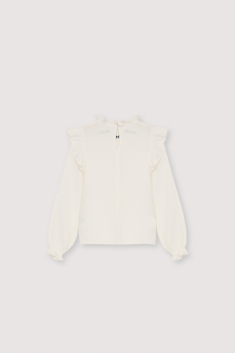 One of our signature double gauze blouse styles, featuring a contrasting embroidery detail at the front for a subtle yet elegant touch. Made from soft, breathable 100% cotton.
