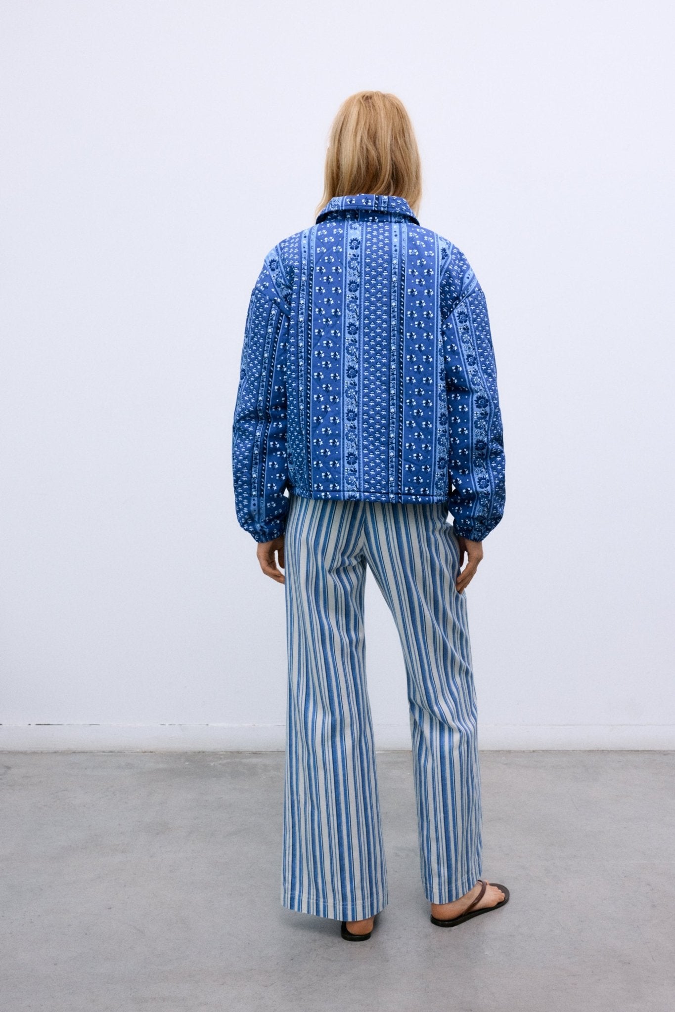 Quilted cotton jacket designed for lightweight comfort during the spring and summer seasons.