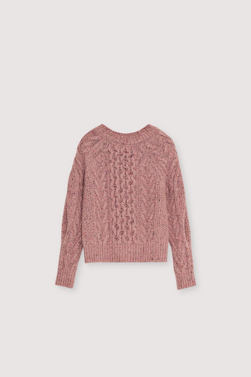 Pink cable knit sweater on a light gray background