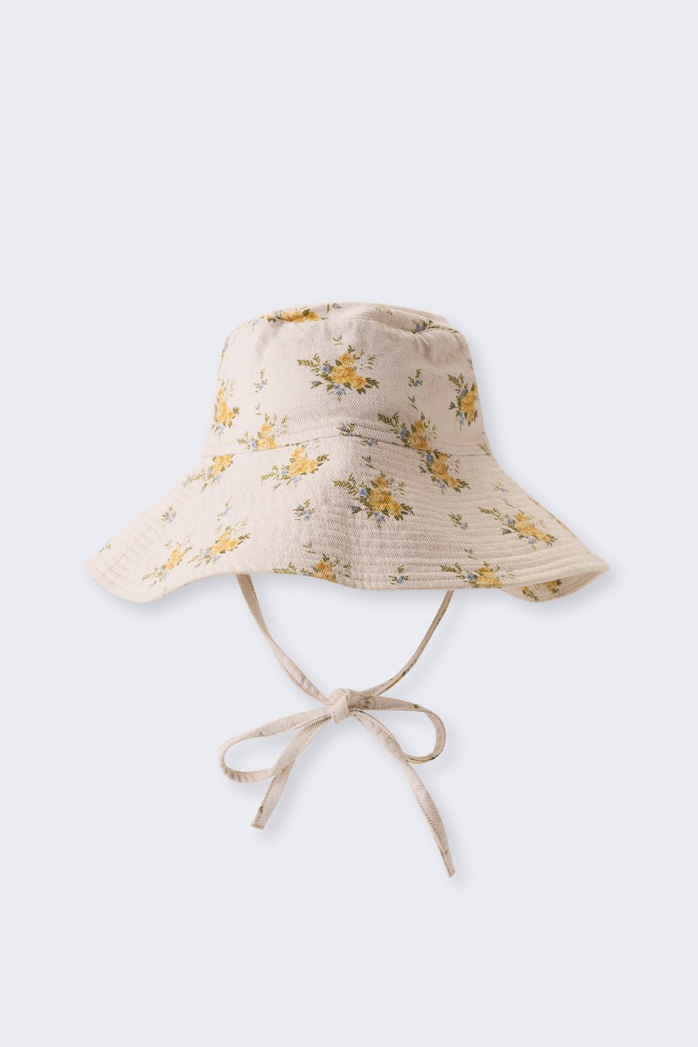 Crafted from organic cotton denim, this bucket hat features a beautiful contrasting floral print. Designed with a wide brim and adjustable ties for a secure and comfortable fit.