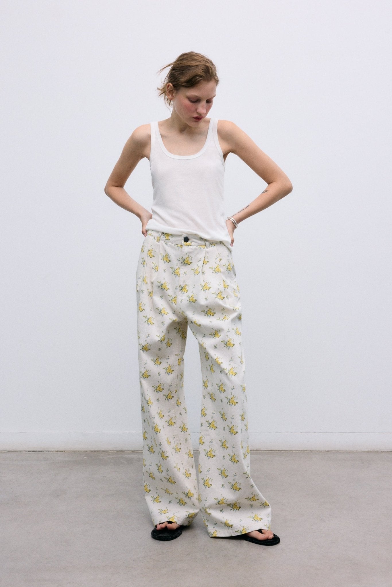 Pleated Denim Pants in Organic Cotton
Our classic pleated silhouette is reimagined in a refined organic cotton denim, featuring a beautiful floral print.