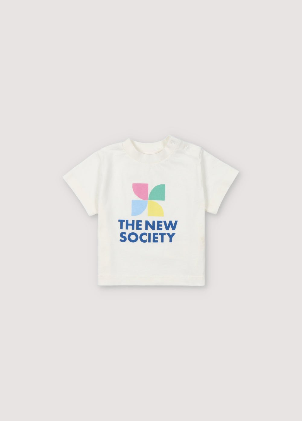 T-shirt à manches courtes et épaules tombantes avec logo coloré sur le devant et ouverture d'épaule par boutons-pression ton sur ton. Collection Printemps Été. The New Society.