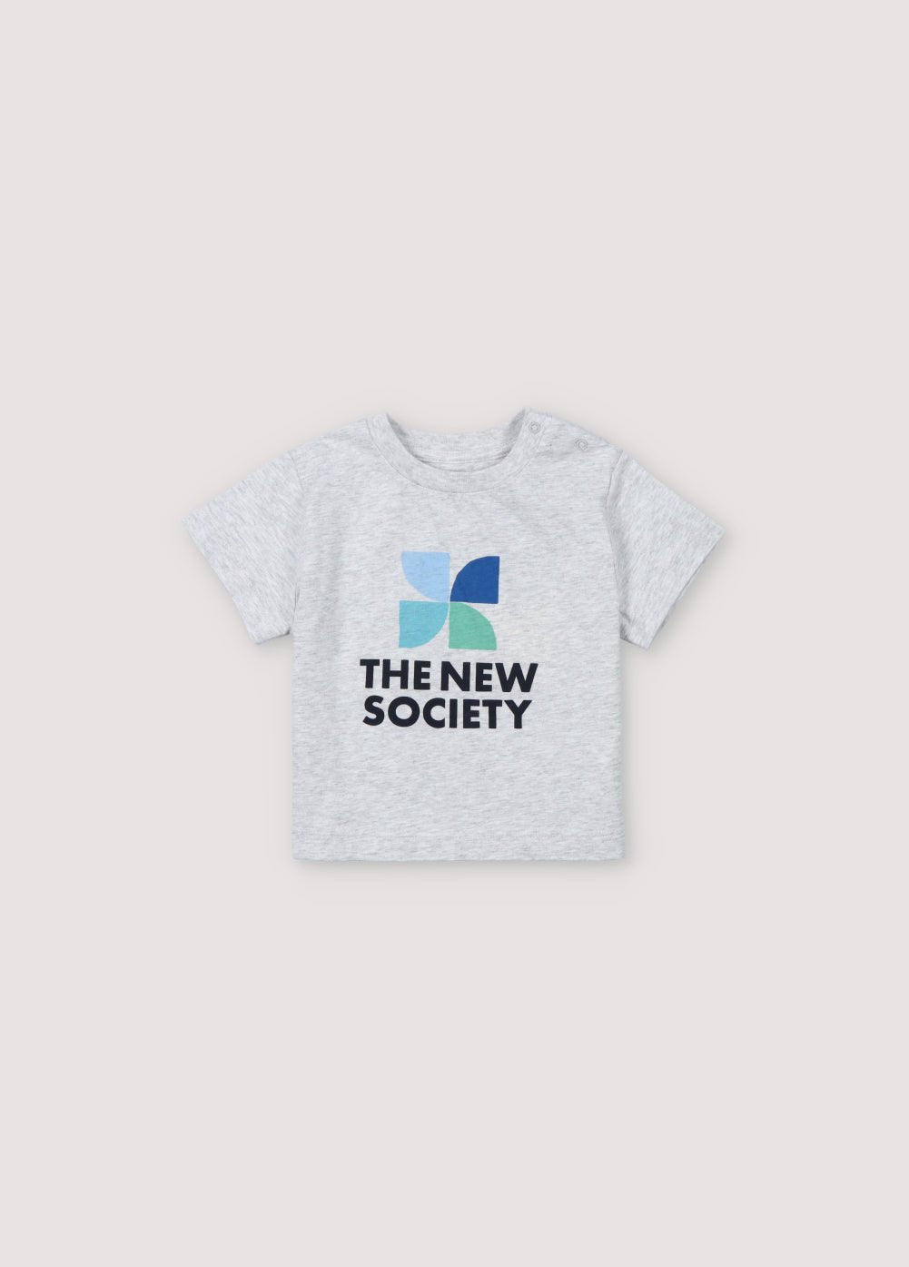 T-shirt à manches courtes et épaules tombantes avec logo coloré sur le devant et ouverture d'épaule par boutons-pression ton sur ton. Collection Printemps Été. The New Society.