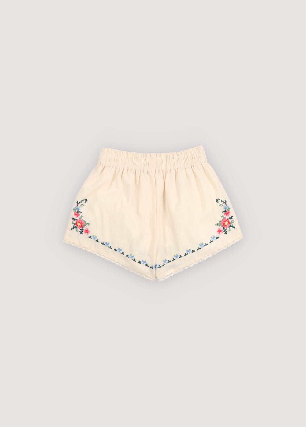 Shorts in soft cotton featuring a comfortable elastic waistband and beautiful embroidered details that add a delicate, handcrafted touch.