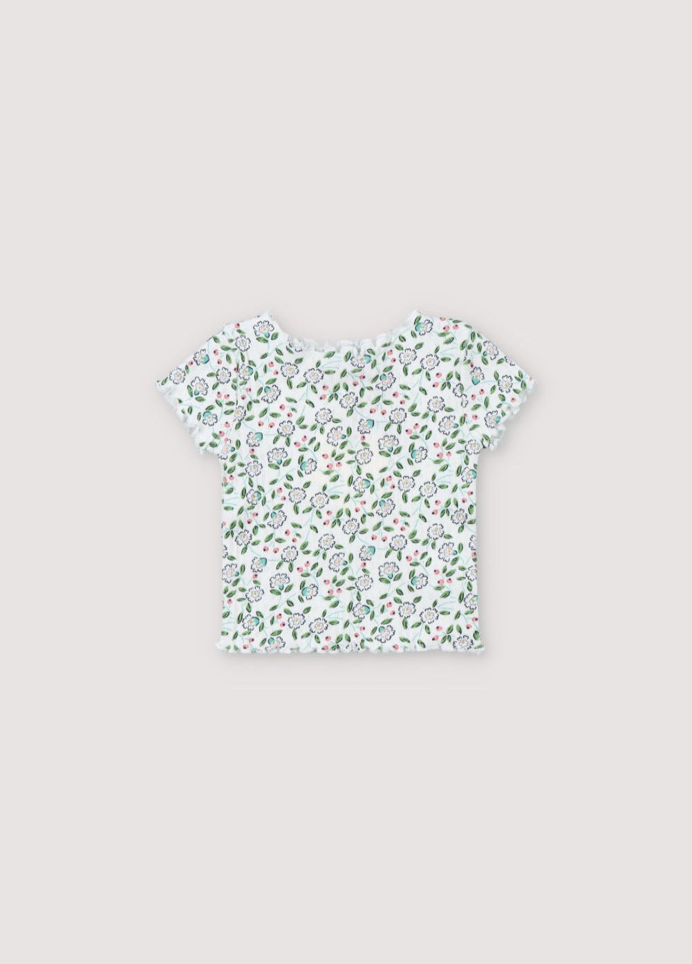 T-shirt côtelé à manches courtes avec un joli imprimé fleuri et des finitions baby overlock au col, aux poignets et à la base. Il est livré avec des leggings assortis. Collection Printemps Été. The New Society.