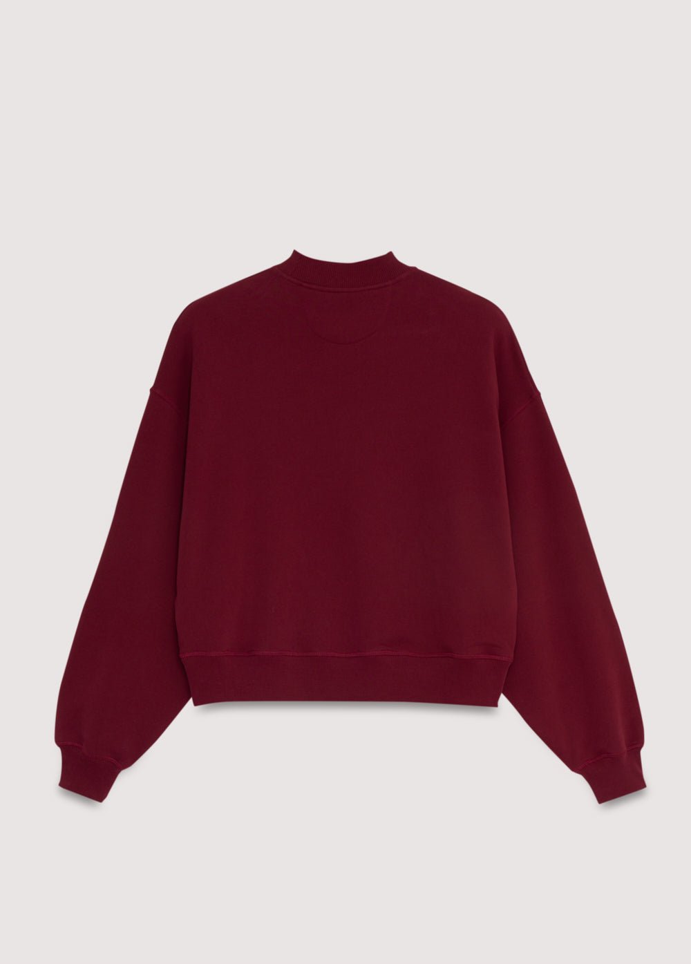 Crop-style sweatshirt with a ribbed high neck and a NOWHERE print detail on the front. Brushed on the inside and outside.