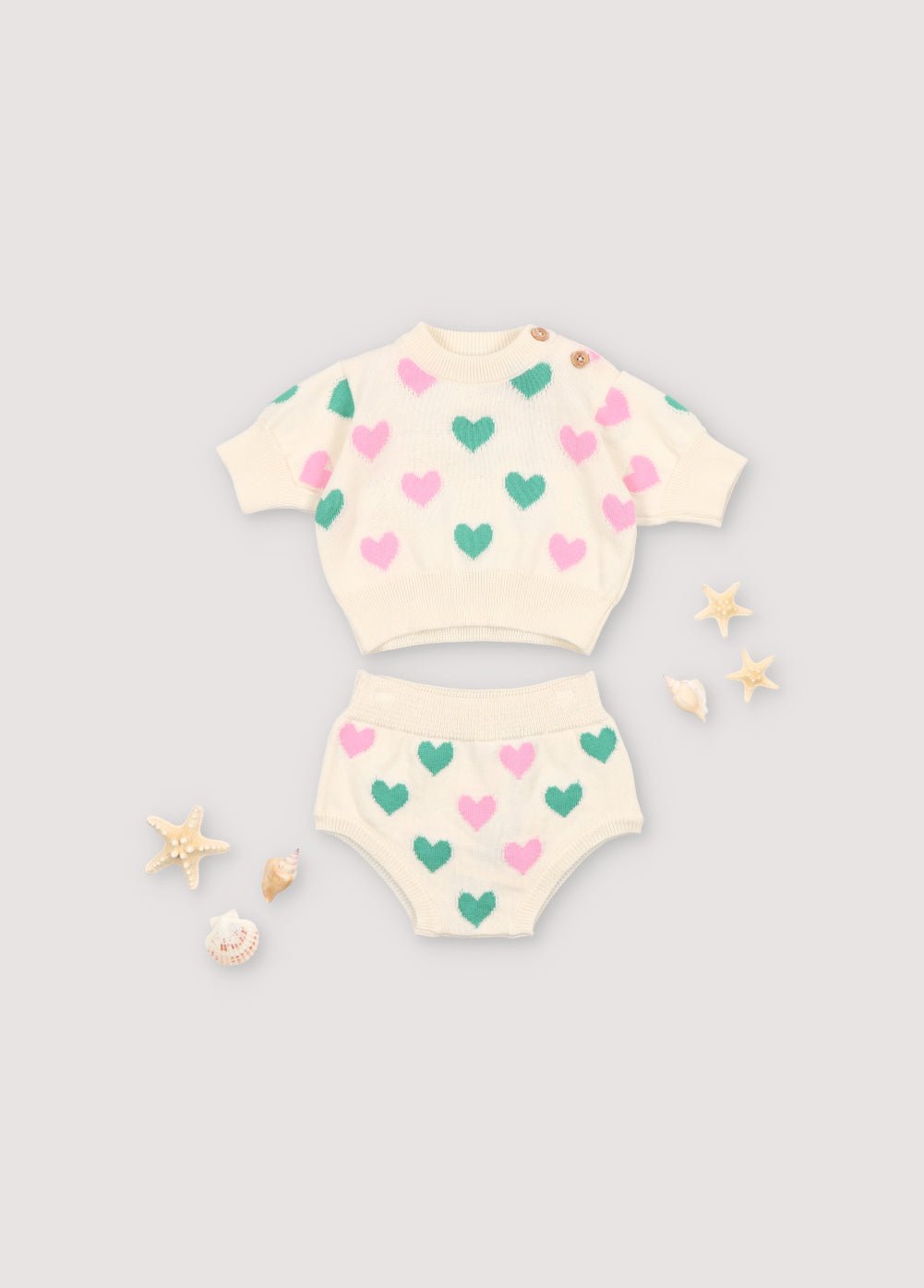 Bicolor heart intarsia bloomer with ribbed waistband and cuffs. It has a matching top. Spring Summer Collection. The New Society.