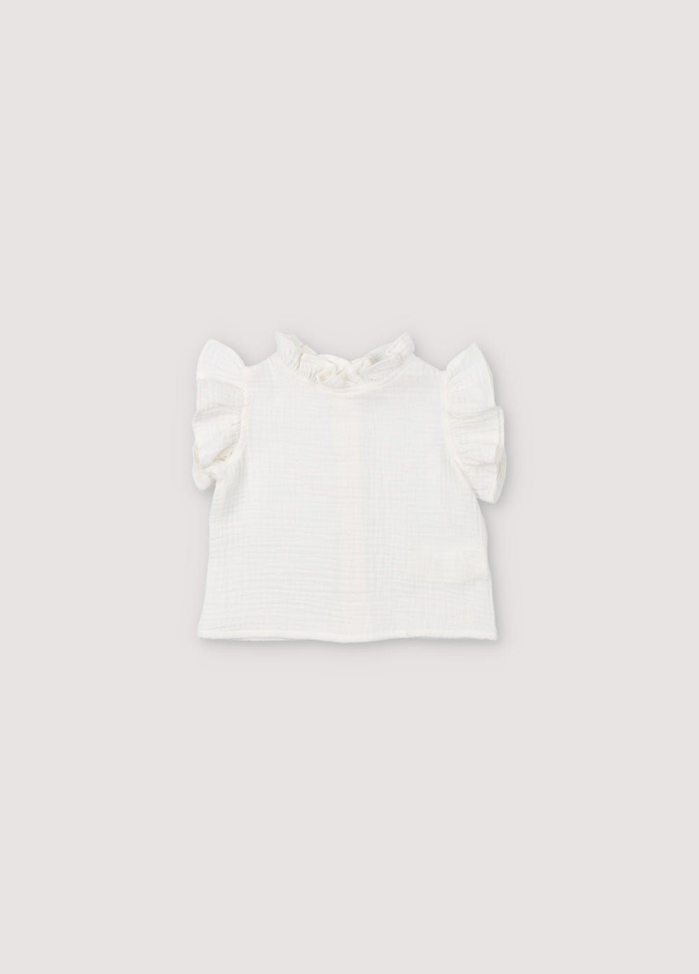 Spyros Baby Blouse in 100% cotton muslin fabric in our coconut color. Broderie TNS Kids assortie. Collection Printemps Été. The New Society.