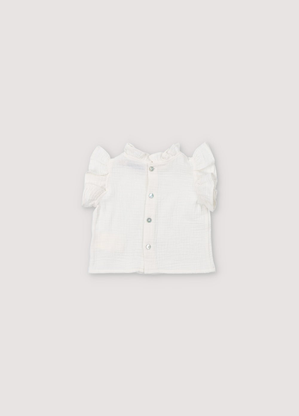 Spyros Baby Blouse in 100% cotton muslin fabric in our coconut color. Broderie TNS Kids assortie. Collection Printemps Été. The New Society.