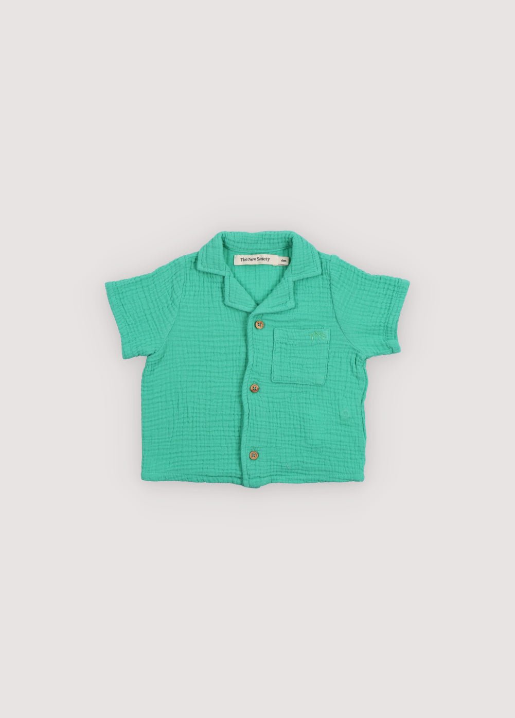 Chemise bébé Spyros en tissu mousseline 100% coton dans notre couleur jade. Broderie TNS Kids assortie. Collection Printemps Été. The New Society.