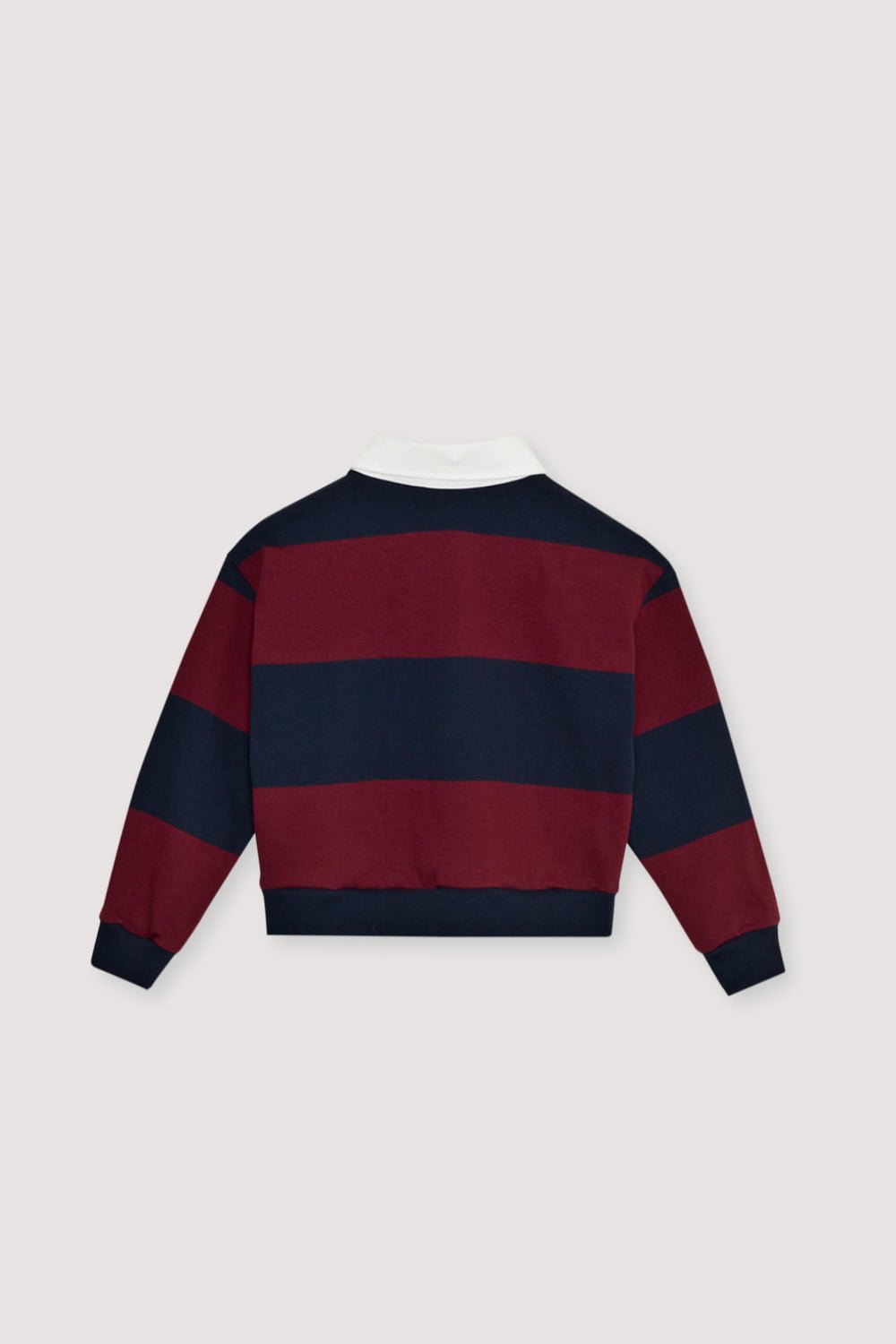 Bicolor striped crop polo with a contrasting collar in twill fabric. It features a contrasting print on the chest.