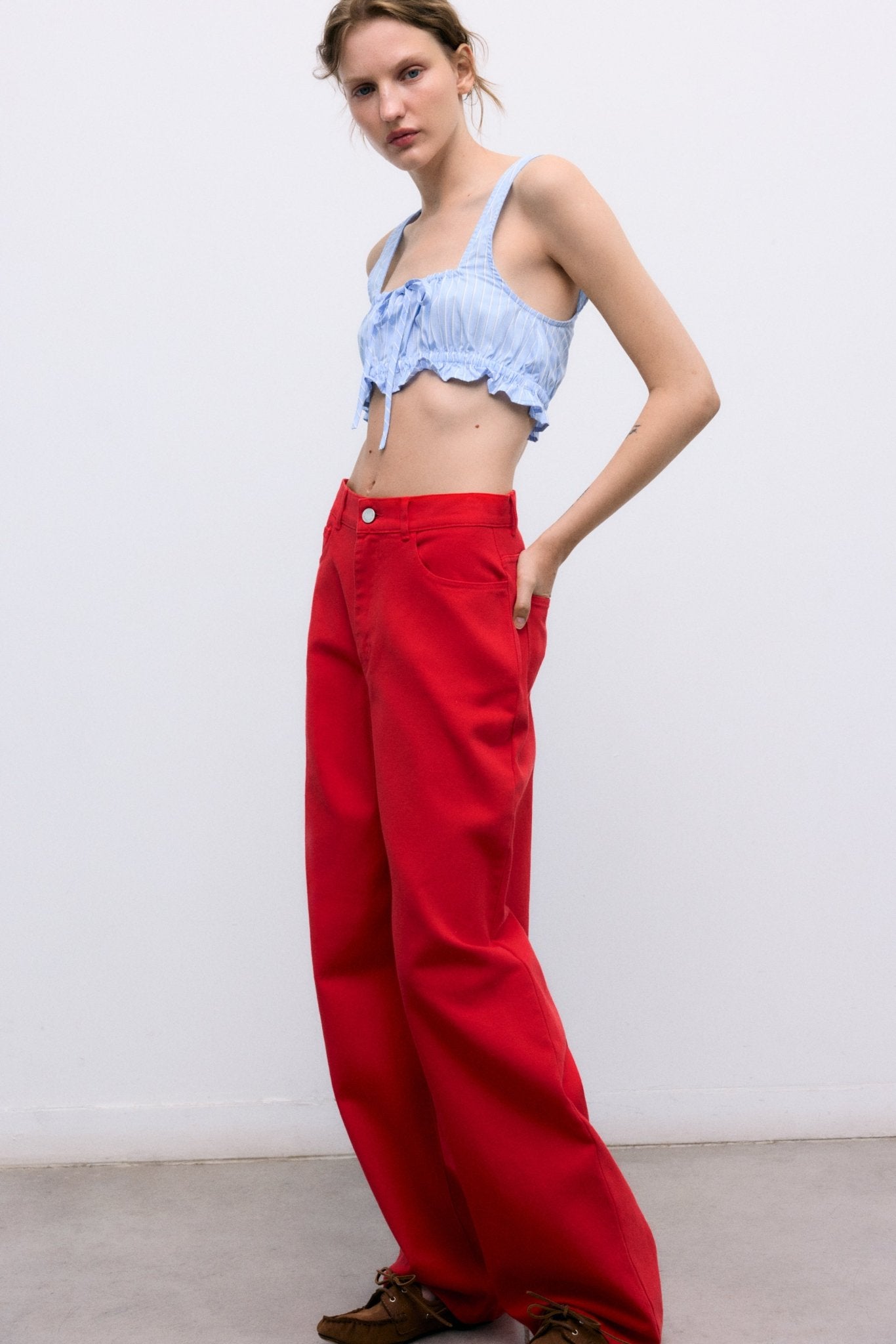 Our classic wide-leg pants crafted from soft 100% cotton denim, now available in a beautiful red shade that adds character and style to any outfit.